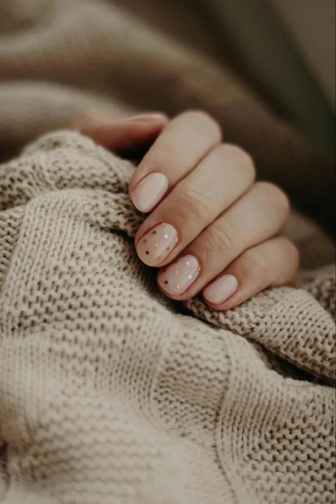 close up photo of a hand feeling the softness of a cashmere sweater